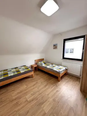 Ein Bett oder Betten in einem Zimmer der Unterkunft Wohnen BI
