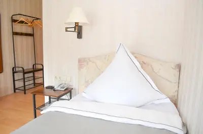Ein Bett oder Betten in einem Zimmer der Unterkunft Hotel Harzer am Kurpark