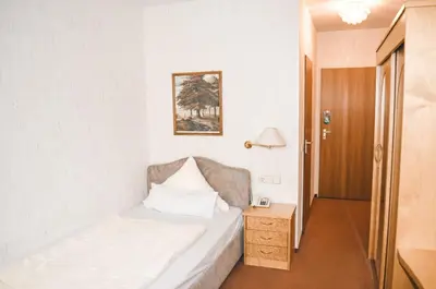 Ein Bett oder Betten in einem Zimmer der Unterkunft Hotel Harzer am Kurpark
