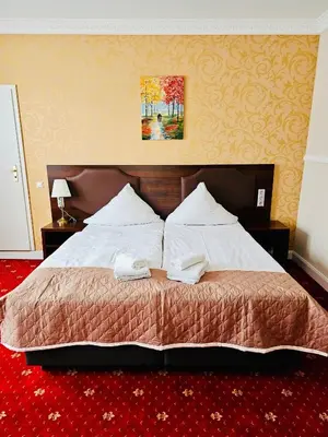 Ein Bett oder Betten in einem Zimmer der Unterkunft Gala Hotel