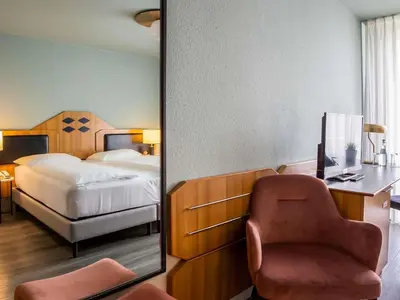 Ein Bett oder Betten in einem Zimmer der Unterkunft Mercure Hotel Pforzheim