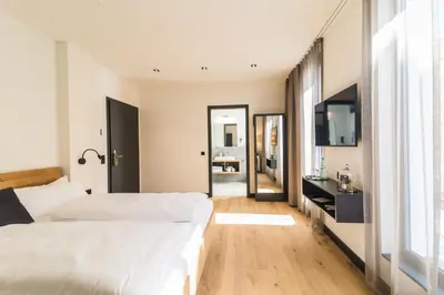 Ein Bett oder Betten in einem Zimmer der Unterkunft WeinQuartier Bissersheim