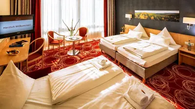 Ein Bett oder Betten in einem Zimmer der Unterkunft Hotel Löwengarten