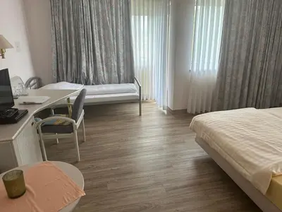 Ein Bett oder Betten in einem Zimmer der Unterkunft Hotel Garni Classico
