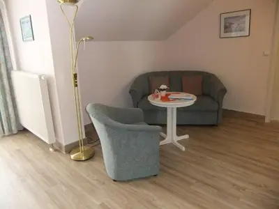 Ein Sitzbereich in der Unterkunft Hotel Garni Classico