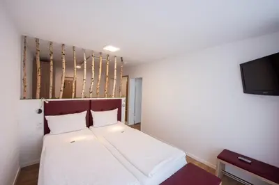 Ein Bett oder Betten in einem Zimmer der Unterkunft PANORAMA HOTEL in Neustadt an der Weinstraße