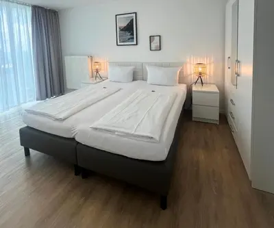 Ein Bett oder Betten in einem Zimmer der Unterkunft PANORAMA HOTEL in Neustadt an der Weinstraße