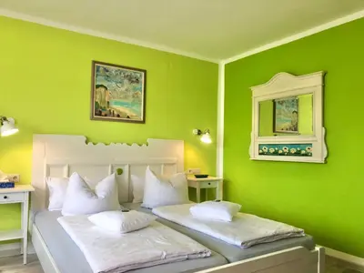 Ein Bett oder Betten in einem Zimmer der Unterkunft Haus am Kurpark