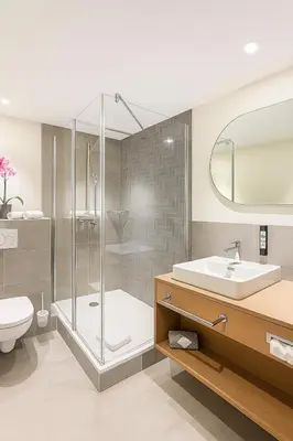 Ein Badezimmer in der Unterkunft Dom Hotel