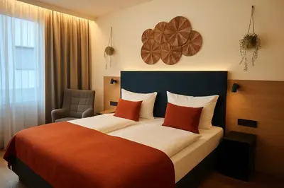 Ein Bett oder Betten in einem Zimmer der Unterkunft Dom Hotel