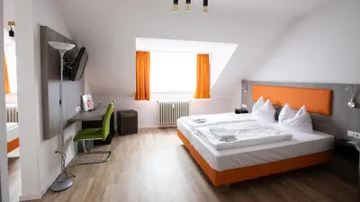 Ein Bett oder Betten in einem Zimmer der Unterkunft Hotel Astoria