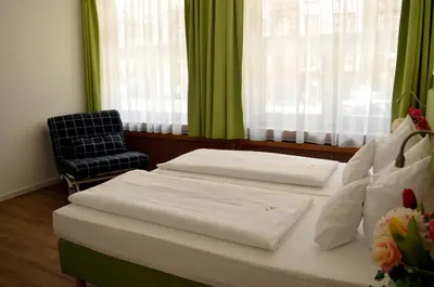 Ein Bett oder Betten in einem Zimmer der Unterkunft Hotel Astoria