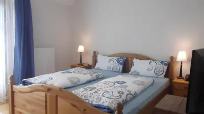 Ein Bett oder Betten in einem Zimmer der Unterkunft Pfälzer Landhotel Heinrich