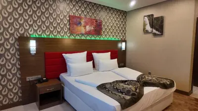 Ein Bett oder Betten in einem Zimmer der Unterkunft Airport Global Hotel