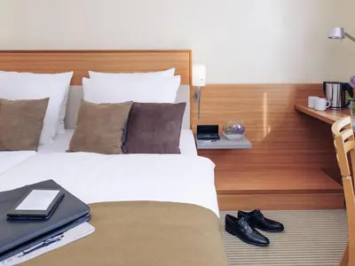 Ein Bett oder Betten in einem Zimmer der Unterkunft Mercure Hotel Mannheim am Rathaus