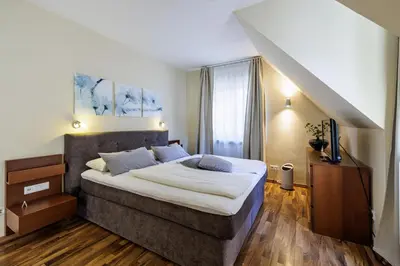 Ein Bett oder Betten in einem Zimmer der Unterkunft Flair Hotel Hopfengarten