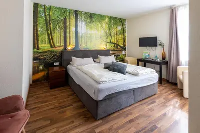 Ein Bett oder Betten in einem Zimmer der Unterkunft Flair Hotel Hopfengarten