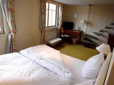 Ein Bett oder Betten in einem Zimmer der Unterkunft Hotel Freihof