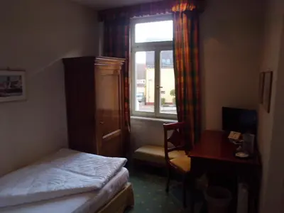 Ein Bett oder Betten in einem Zimmer der Unterkunft Hotel Freihof
