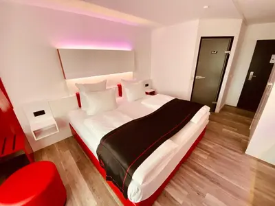 Ein Bett oder Betten in einem Zimmer der Unterkunft DORMERO Hotel Bretten
