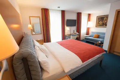 Ein Bett oder Betten in einem Zimmer der Unterkunft Maurers Zollamt Hotel