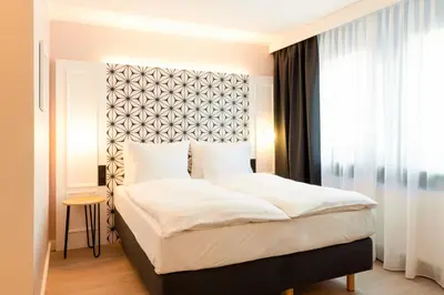 Ein Bett oder Betten in einem Zimmer der Unterkunft Garner Hotel Mannheim City by IHG