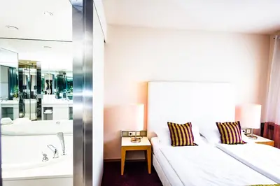 Ein Bett oder Betten in einem Zimmer der Unterkunft Hotel Der Blaue Reiter Design- & Tagungshotel