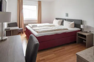Ein Bett oder Betten in einem Zimmer der Unterkunft Hotel Maurer