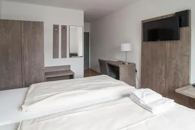 Ein Bett oder Betten in einem Zimmer der Unterkunft Hotel Maurer