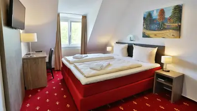 Ein Bett oder Betten in einem Zimmer der Unterkunft Hotel Maurer