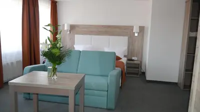 Ein Sitzbereich in der Unterkunft Komfort Hotel Ludwigsburg