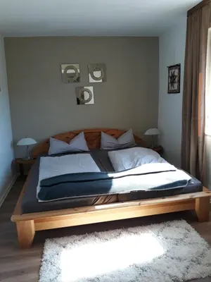 Ein Bett oder Betten in einem Zimmer der Unterkunft Bergfeldhof