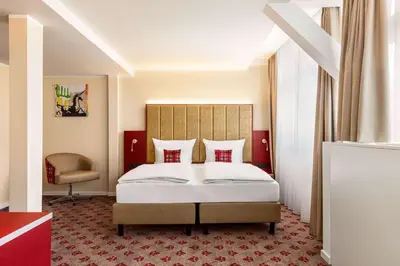Ein Bett oder Betten in einem Zimmer der Unterkunft Amedia Plaza Speyer, Trademark Collection by Wyndham