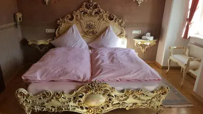Ein Bett oder Betten in einem Zimmer der Unterkunft Schloss Sennfeld - Hotel & Restaurant & Veranstaltungsort