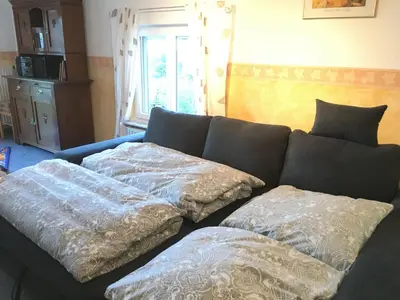 Ein Bett oder Betten in einem Zimmer der Unterkunft Ferienwohnung Südpfalzblick