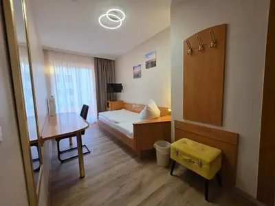 Ein Bett oder Betten in einem Zimmer der Unterkunft Hotel Europa Pforzheim