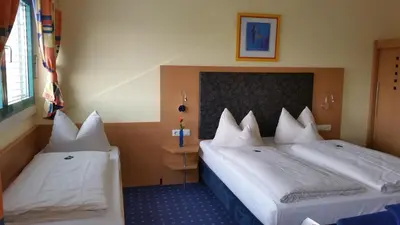 Ein Bett oder Betten in einem Zimmer der Unterkunft Hotel Ifen