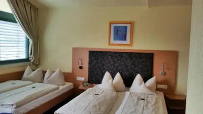 Ein Bett oder Betten in einem Zimmer der Unterkunft Hotel Ifen