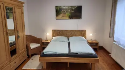 Ein Bett oder Betten in einem Zimmer der Unterkunft Ferienwohnung am Bruchwald