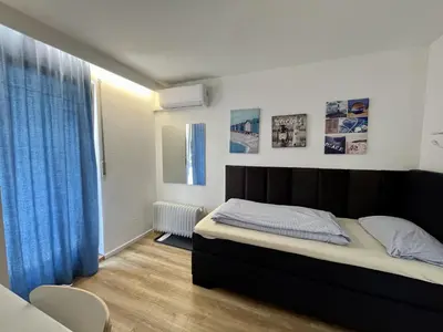 Ein Bett oder Betten in einem Zimmer der Unterkunft Gästehaus Rheinstetten Forchheim
