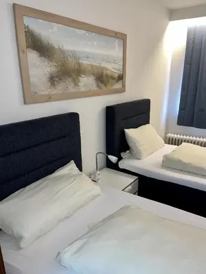 Ein Bett oder Betten in einem Zimmer der Unterkunft Gästehaus Rheinstetten Forchheim