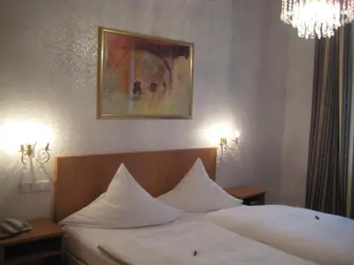 Ein Bett oder Betten in einem Zimmer der Unterkunft Hotel Markgräfler Hof