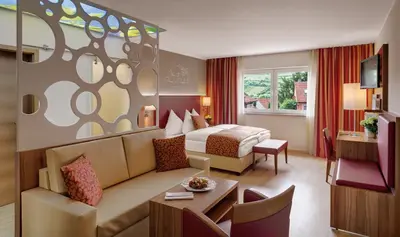 Ein Sitzbereich in der Unterkunft Pfalzhotel Asselheim