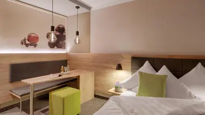 Ein Bett oder Betten in einem Zimmer der Unterkunft Pfalzhotel Asselheim