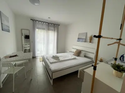 Ein Bett oder Betten in einem Zimmer der Unterkunft Nibelungen Apartments