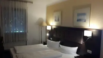 Ein Bett oder Betten in einem Zimmer der Unterkunft Hotel Starkenburger Hof