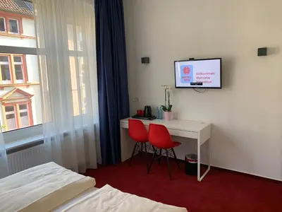 Ein Bett oder Betten in einem Zimmer der Unterkunft Hotel B54 Heidelberg City