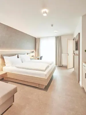 Ein Bett oder Betten in einem Zimmer der Unterkunft Gästehaus Bauer - Schlafen auf dem Weingut
