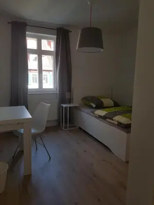 Ein Bett oder Betten in einem Zimmer der Unterkunft Ferienwohnung