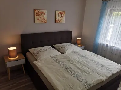 Ein Bett oder Betten in einem Zimmer der Unterkunft FERIENWOHNUNG im Dornröschendorf